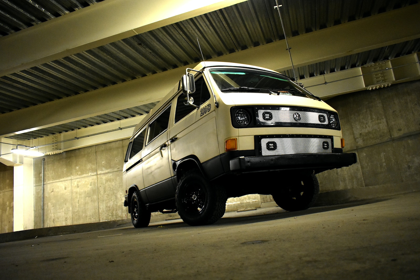 white van near concrete wall